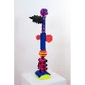 Vibrant, whimsical sculpture composed of colorful spirals, spheres, and cylinders.