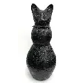 Textured sculpture of a black cat with detailed fur and an alert expression on its face.